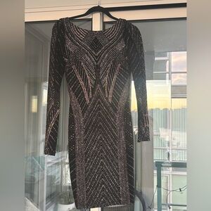 Sparkle gold and silver- black dress only worn once for a NYE party. 
XS